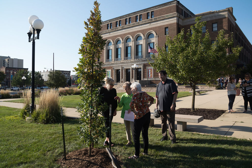 Jennifer and Judy Buchanan, Sonja Reece and Gary Buchanan look at the tree dedicated to Mayor Rich Buchanan